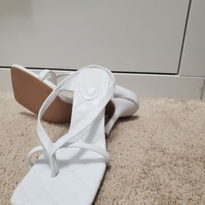 Cute white open shoe .Size 7 . Very comfortable.